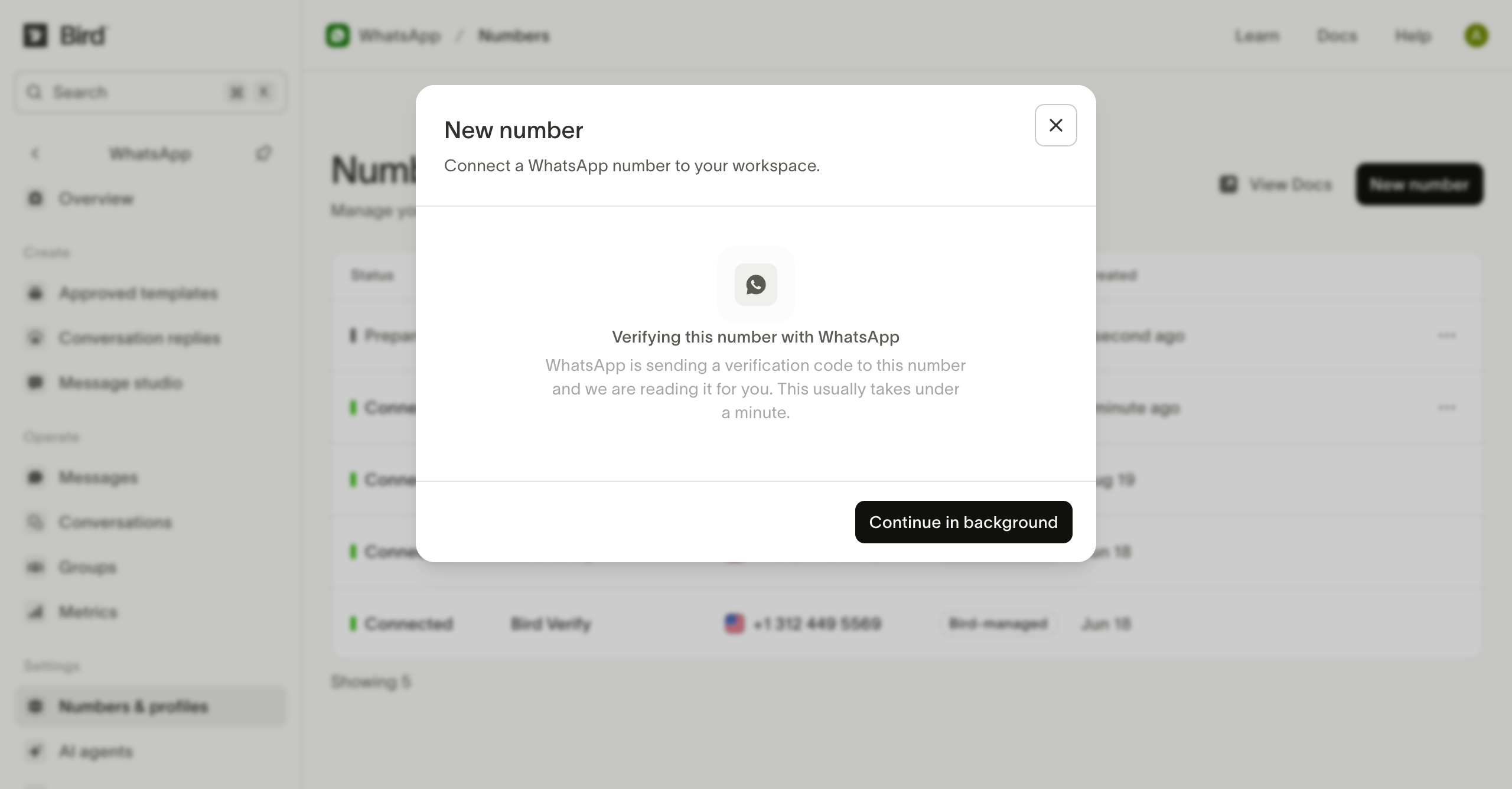 Bird verifying the selected number with WhatsApp, with a Continue in background button.